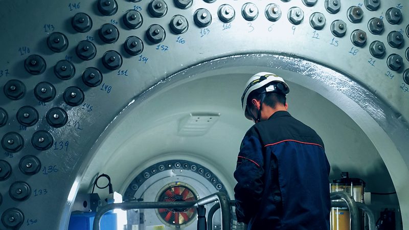 Technician inside a hub beside the bolt circle