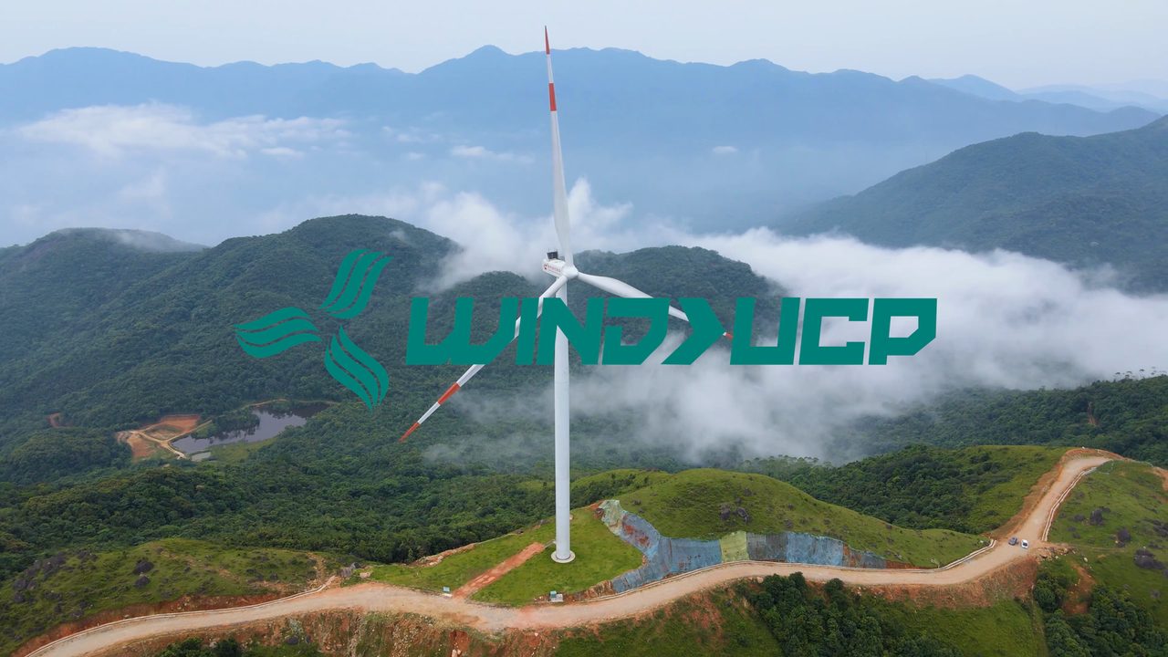 WindX UCP logo over a wind farm above low cloud